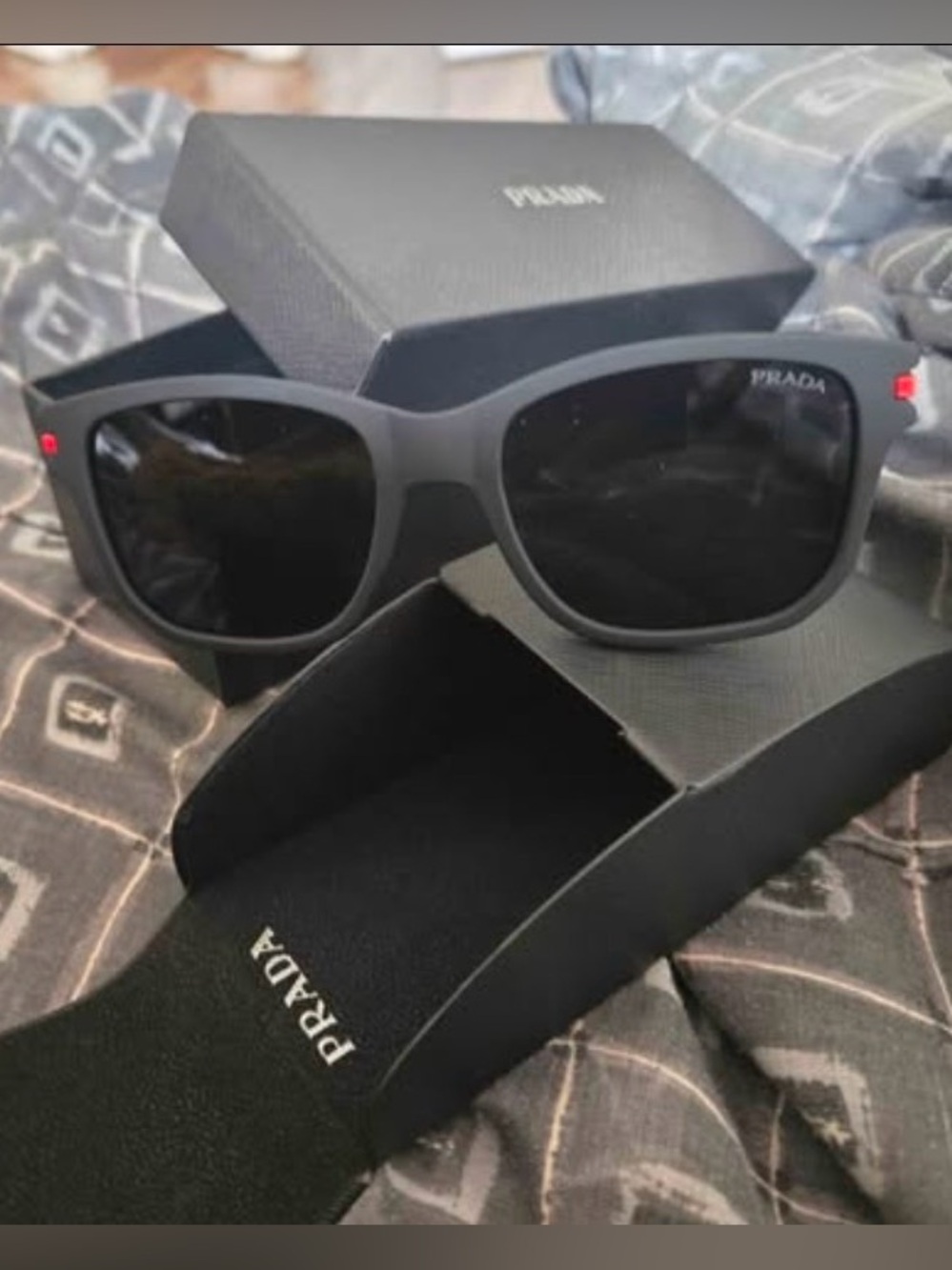 Prada Black Frame Sunglasses with Subtle Red Accent